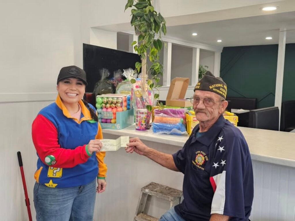 Mike Taylor Presenting check for Easter Egg hunt